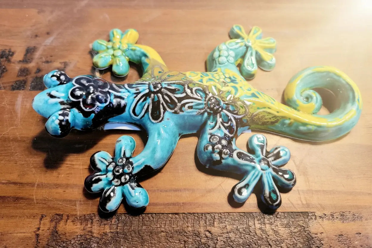Decorative lizard-shaped figurine with floral patterns