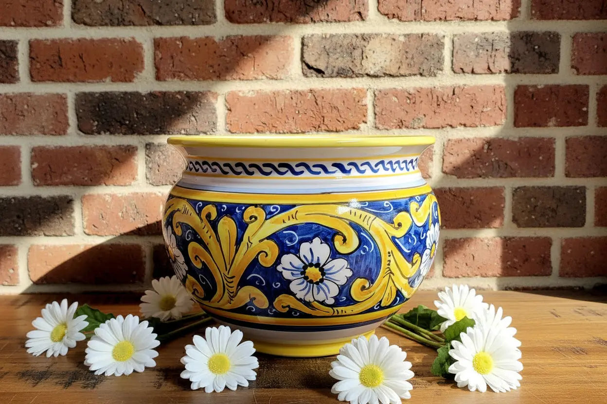 Ceramic vase / planter t with blue and yellow floral patterns 