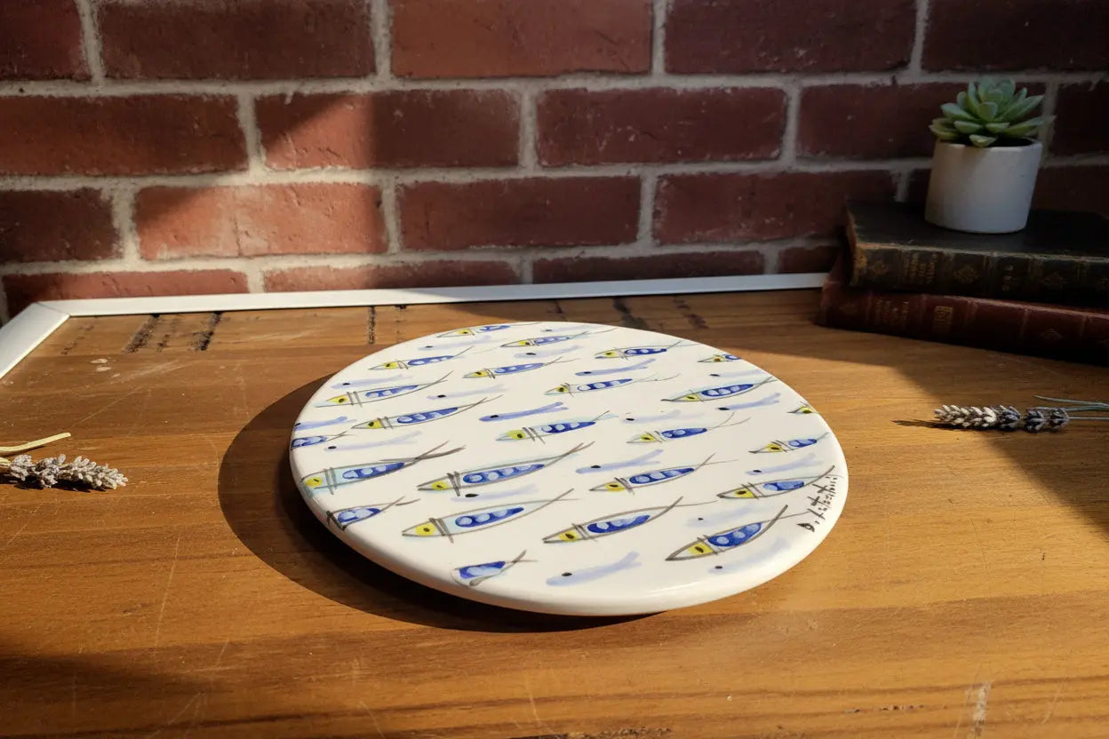 Round ceramic plate / trivet with blue and yellow patterns 