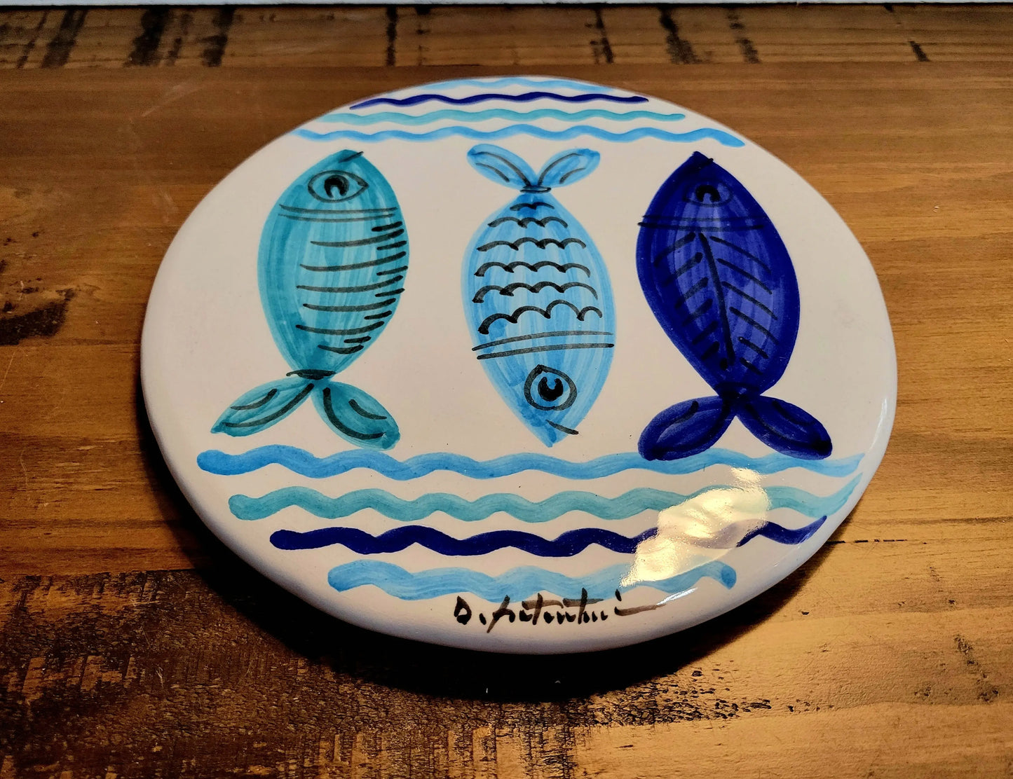 Decorative plate / trivet with blue fish design 