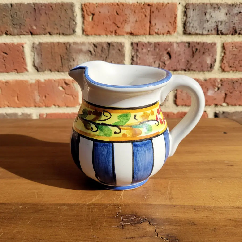 Decorative ceramic pitcher with colorful patterns 