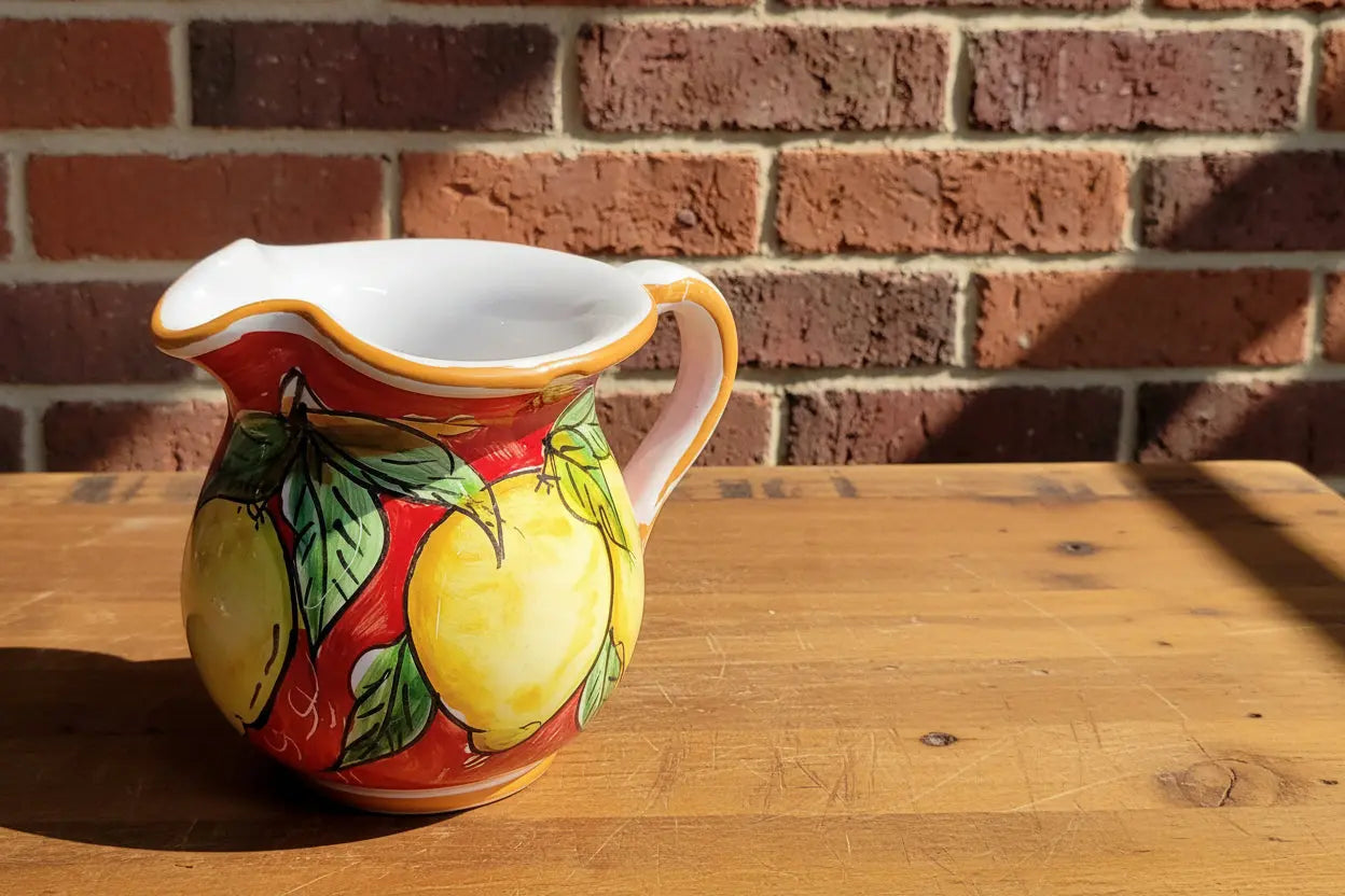 Decorative ceramic pitcher with lemon design 