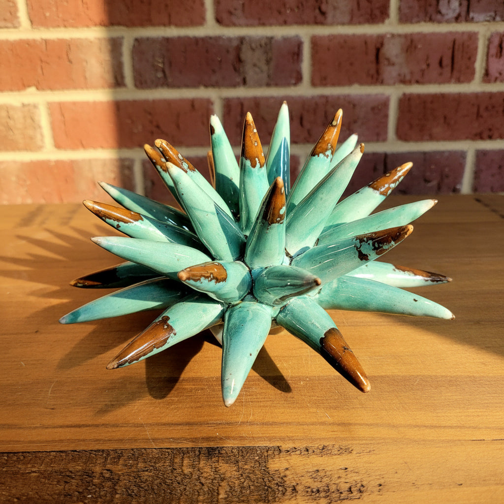 Turquoise ceramic sea urchin with brown accents 
