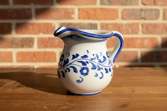 Ceramic pitcher with blue floral patterns 