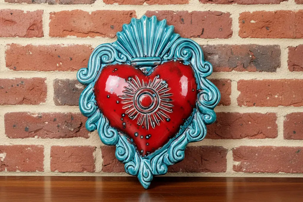 Decorative wall art with a red heart and turquoise border 