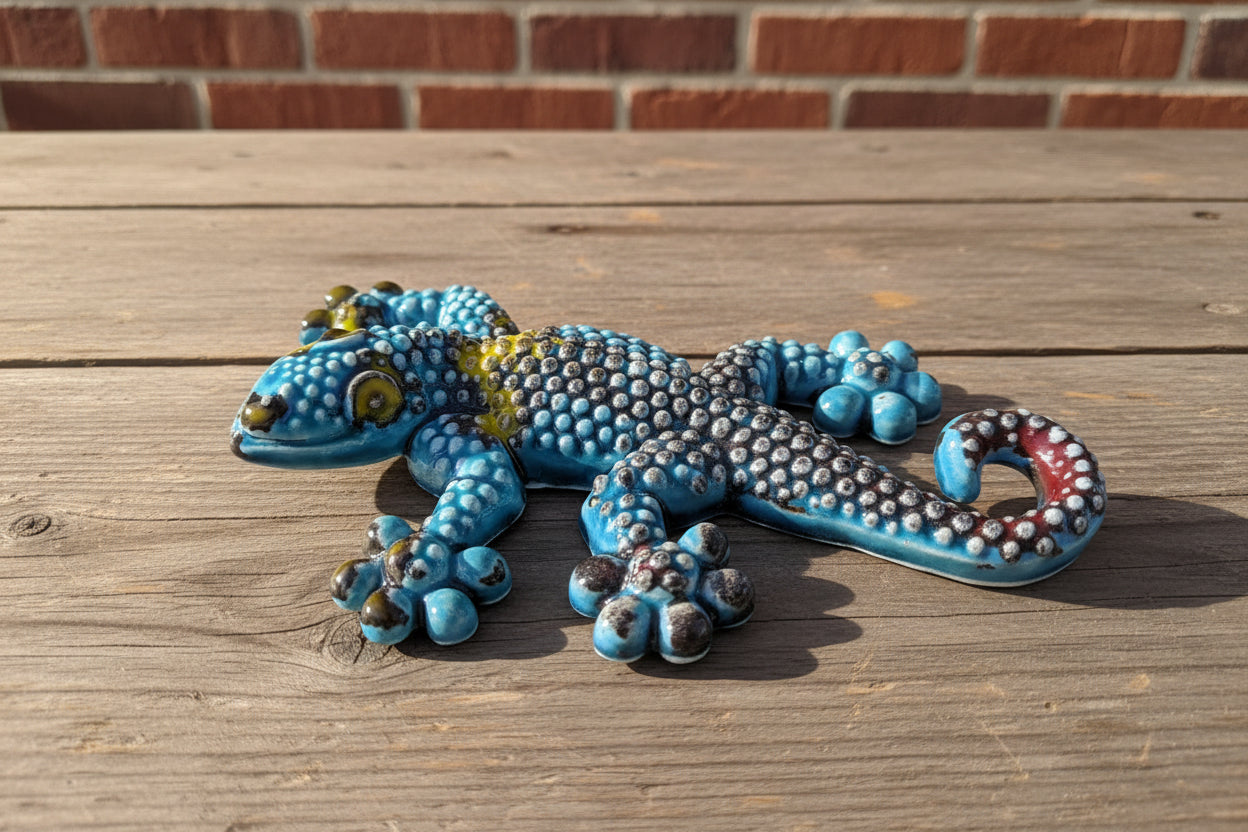 Decorative egcko  lizard figurine with blue and silver scales 