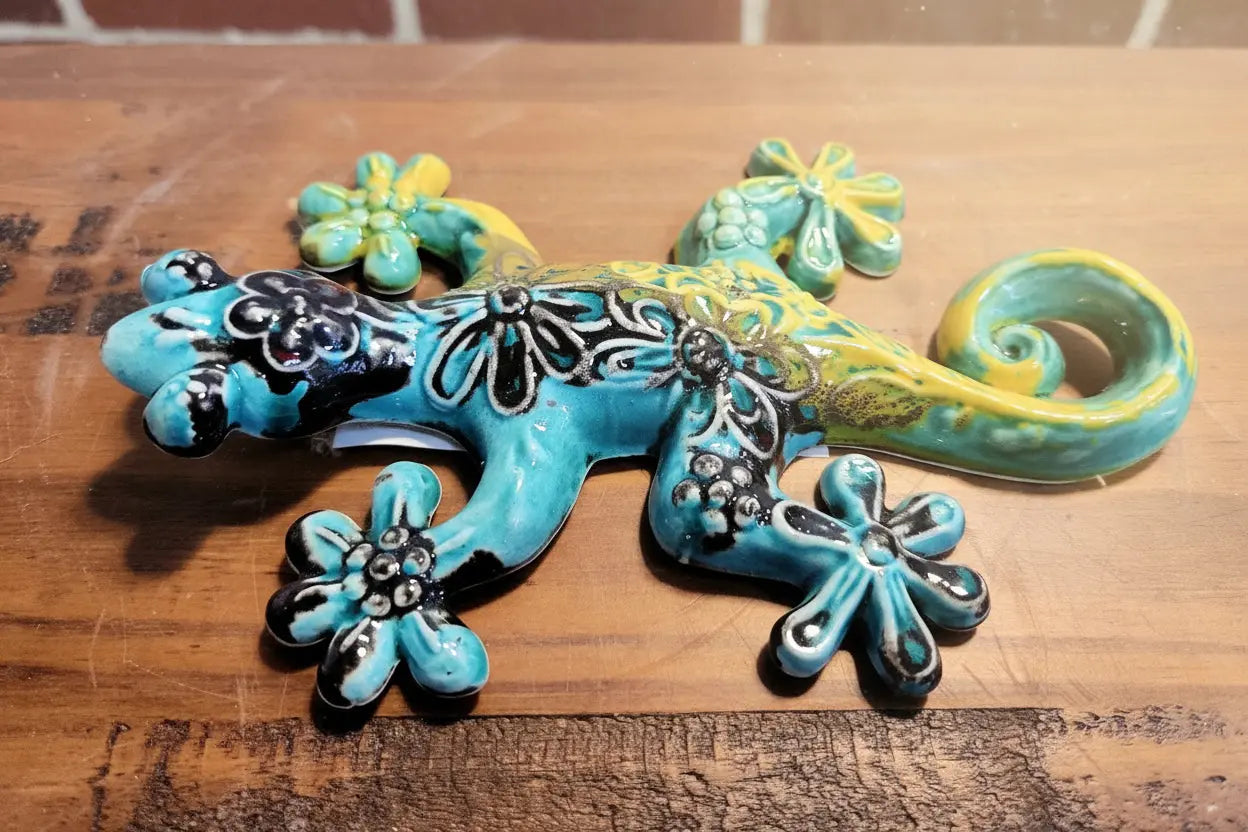 Decorative lizard gecko figurine with blue, green, and yellow colors 
