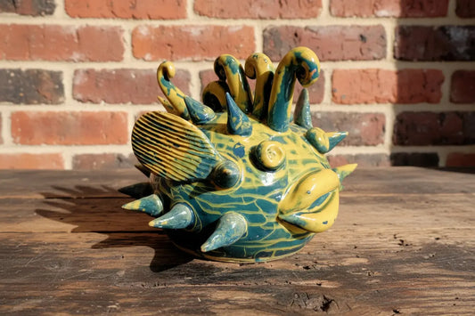 Ceramic yellow and green fish figurine 