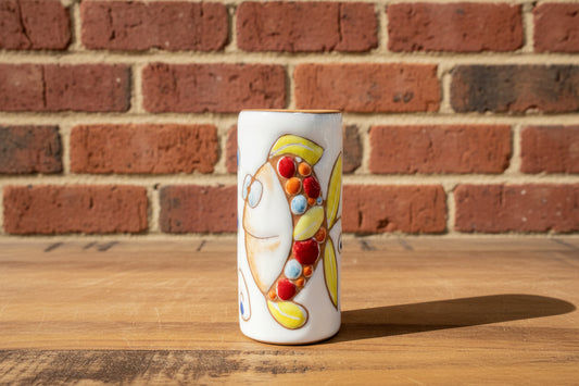 Decorative ceramic vase / toothbrush holder with a cartoon character